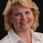 Blond woman wearing white shirt