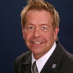 Realtor wearing suit and tie