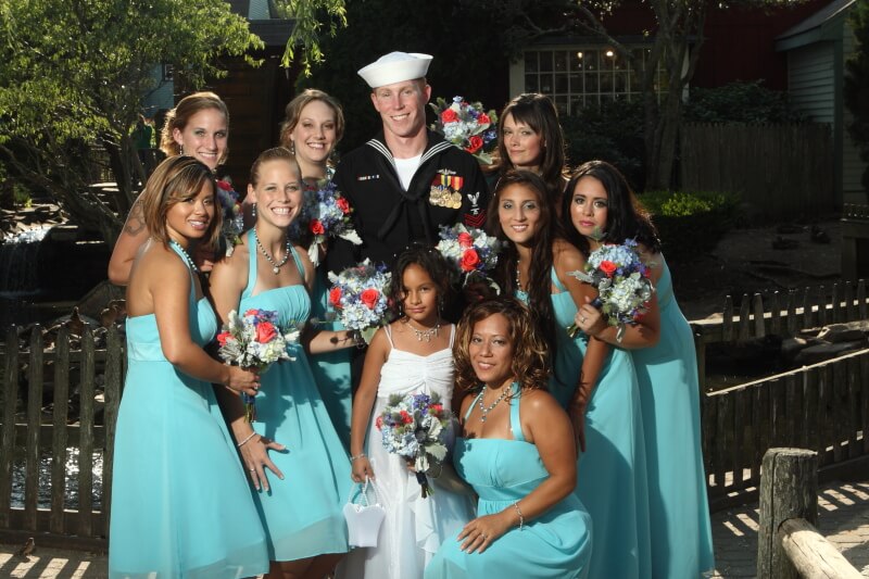 Groom with bridesmaids at Old Mystic Village