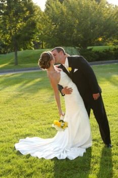 Groom and Bride kissing at wedding